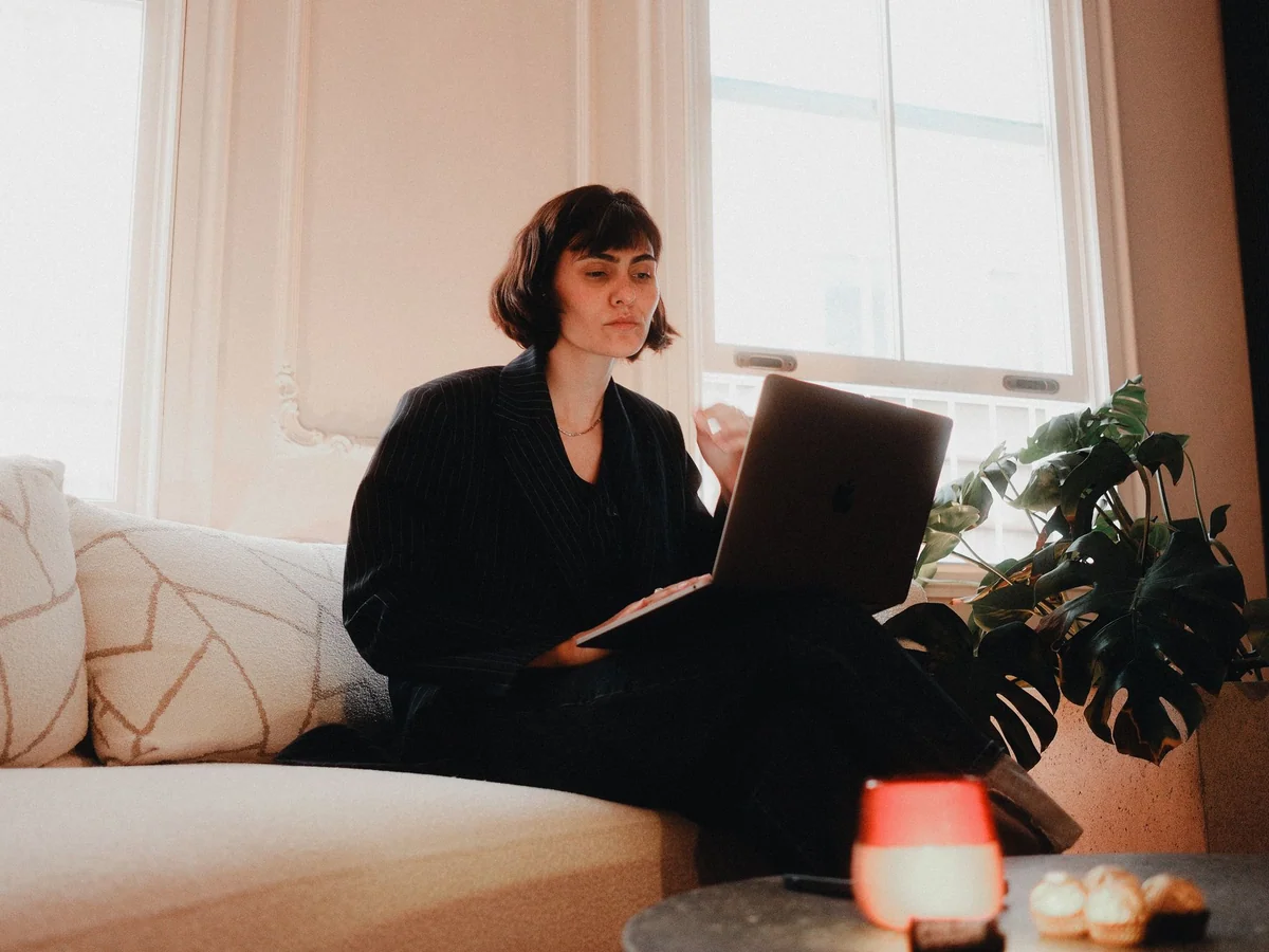 Woman taking a discreet sensory pause at her office desk