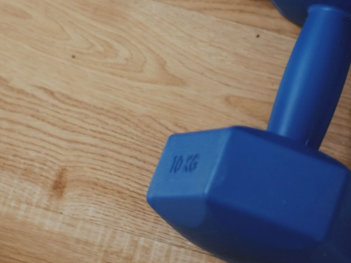 Woman exercising in a compact apartment workout corner
