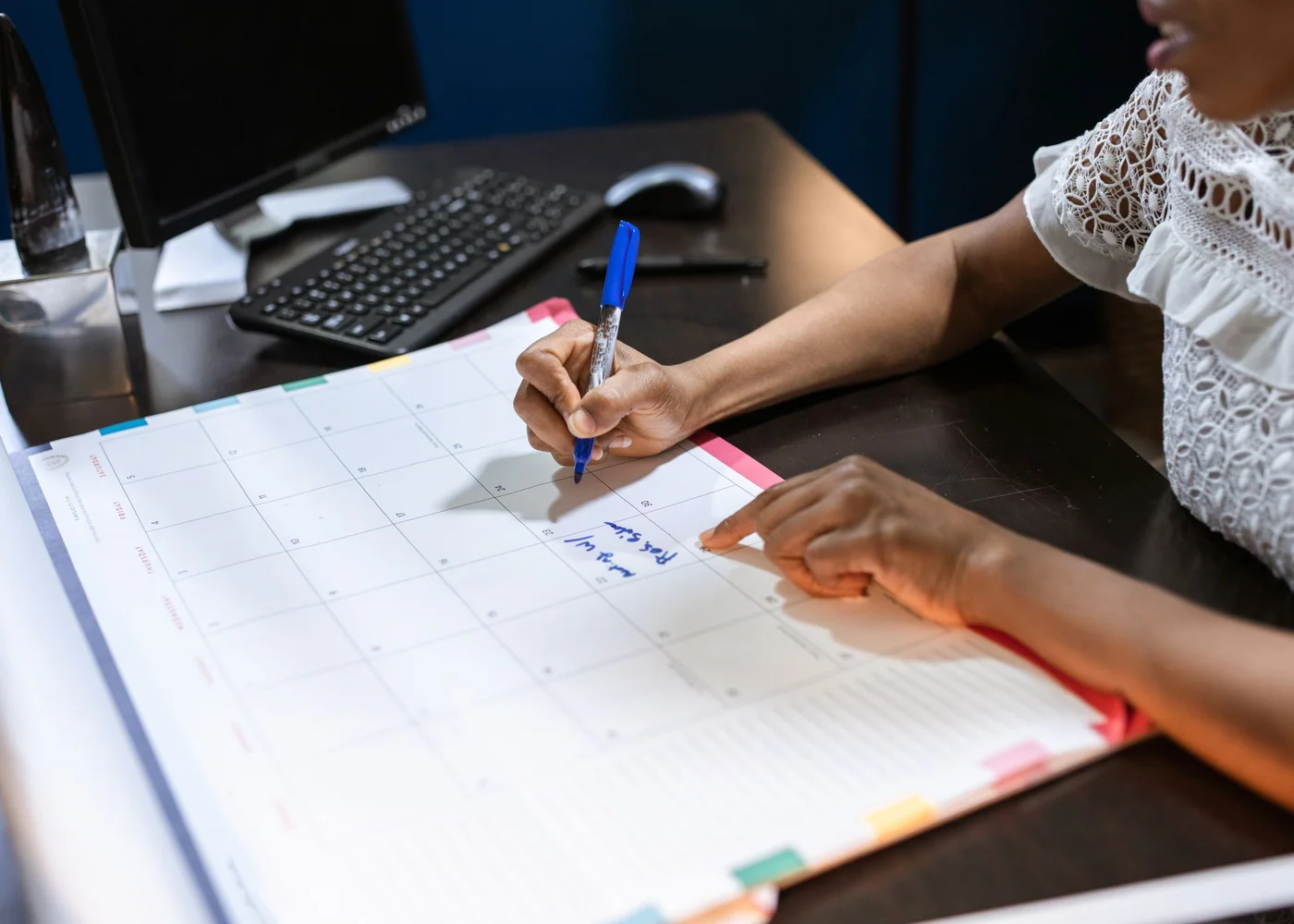 Woman reviewing a balanced weekly wellness plan at home